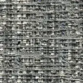 Gray and off-white tweed fabric texture with irregular woven threads, displaying a nubby surface and subtle variegated pattern; “elite 297 21” label.